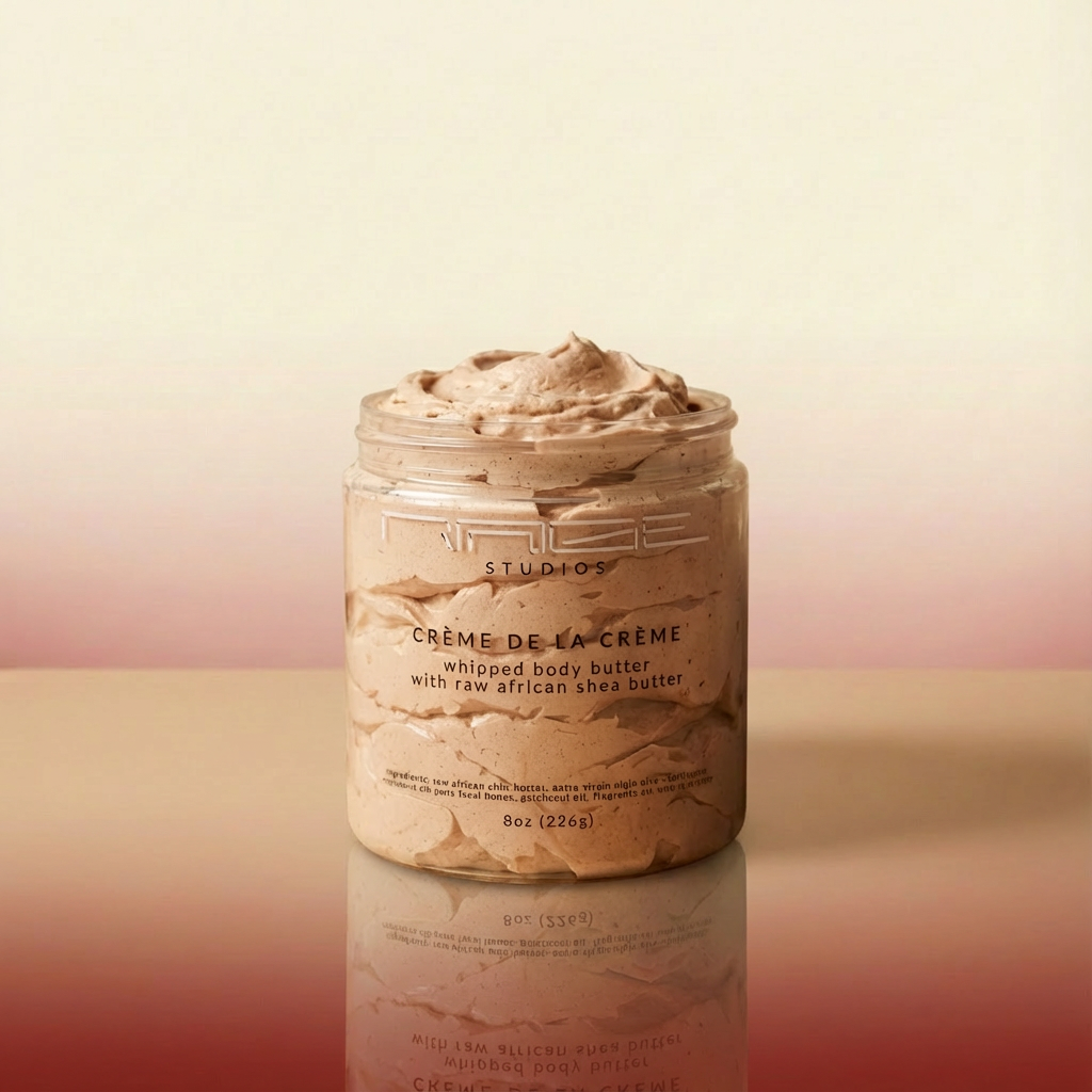 Jar of Creme de la Creme whipped body butter on a reflective surface with a gradient background