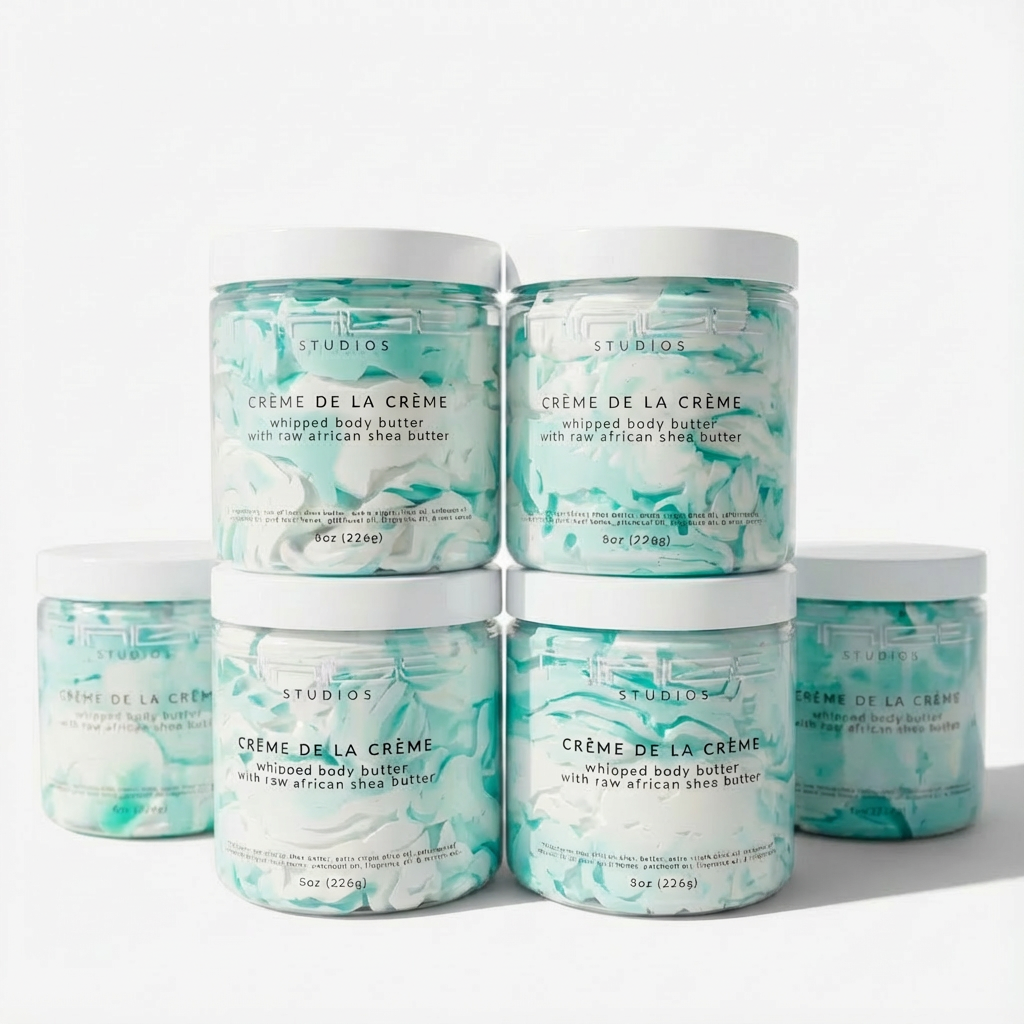 Jars of Crème de la Crème whipped body butter with a white background