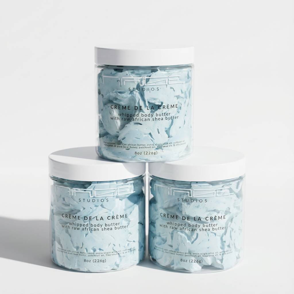Three jars of 'Creme de la Creme' whipped body butter on a white background